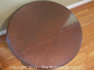 Glass covered Mahogany low table (29" diameter; 19" Tall)