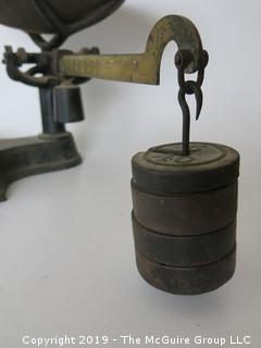 Shopkeepers counterbalance scale with brass dial, weights. 