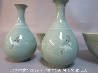 Set of matching Chinese glazed ceramic bowls and hand decorated vases 