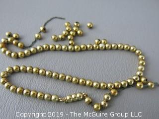 13" 14k gold baby beads; strung on non-gold chain; needs to be restrung; 10.2g