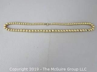 16 1/2" string of graduated faux gold beads