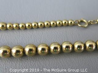 16 1/2" string of graduated faux gold beads