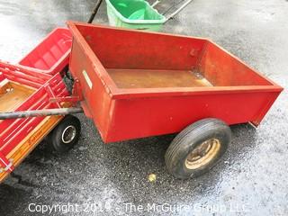 Collection including wooden red Wagon, tractor pulled metal dump wagon and (2) fertilizer spreaders