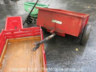 Collection including wooden red Wagon, tractor pulled metal dump wagon and (2) fertilizer spreaders