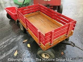 Collection including wooden red Wagon, tractor pulled metal dump wagon and (2) fertilizer spreaders