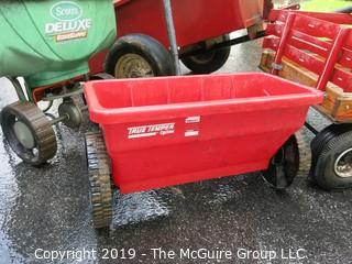 Collection including wooden red Wagon, tractor pulled metal dump wagon and (2) fertilizer spreaders