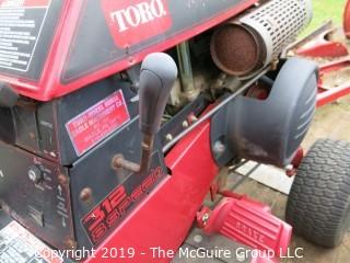 Toro Wheelhorse Lawn Tractor; 1000 hours; Model 78345; SN 8901393; Kohler Command 12.5 Pro Series 8-Speed; fitted with 42" side discharge Toro mowerdeck, Model 74328, SN 8900544; needs battery, key and tune-up according to consignor (NOTE: Description altered 9/7/5:36am) 