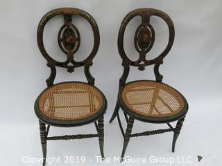 Pair of stenciled balloon back wooden chairs with plastic woven seats; 18W x 16D x 36T"