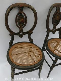 Pair of stenciled balloon back wooden chairs with plastic woven seats; 18W x 16D x 36T"