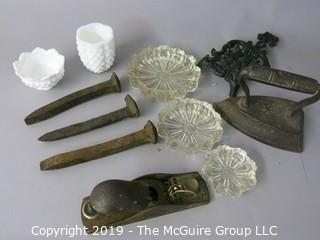 Collection including flat iron, trivet, block plane, ashtrays, milk glass and hand forged railroad spikes