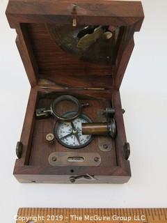 Marine Master Box containing brass compass. brass telescope, brass scale with chart, brass spirit level, brass alidade with coloured glass and brass boat clinometer.  