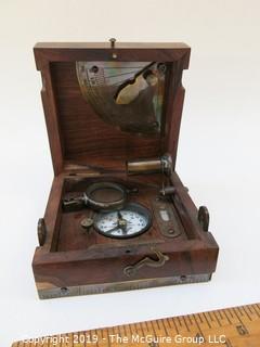 Marine Master Box containing brass compass. brass telescope, brass scale with chart, brass spirit level, brass alidade with coloured glass and brass boat clinometer.  