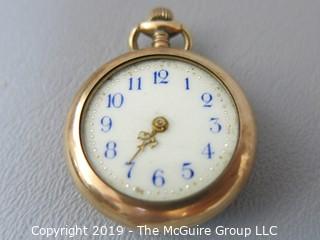 Elgin 10k small pocket watch with damaged enamel back; missing crystal and minute hand 