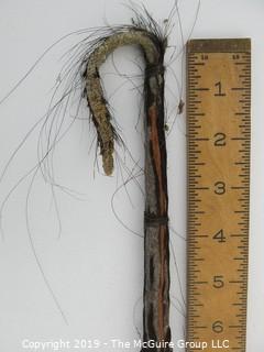 Crook or staff with animal hair. Goat herding item?