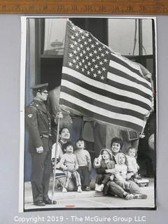 Photo: credited: Historical; Americana: Art: patriotic families during Flag Day 1977