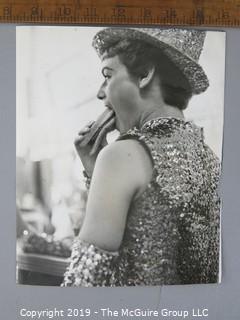 Photo: uncredited: Historical; Americana: Parade girl eating a hot dog