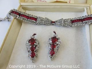 Jewelry: Quality faux ruby and rhinestone bracelet and earring set with necklace. Similar to the HEART brooch. Could not find any markings.